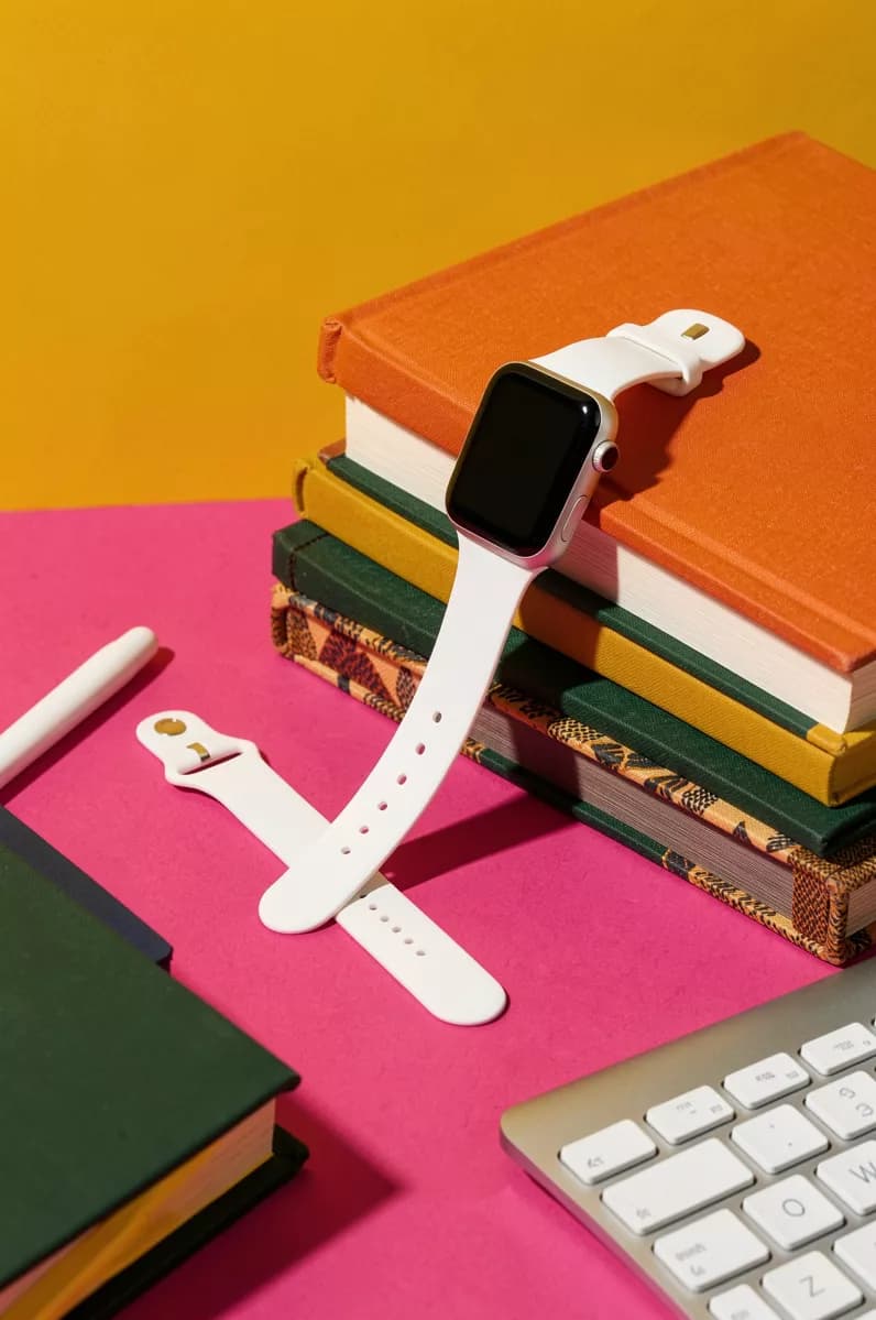 Product and e-commerce: A colour-blocked product still life: a white smartwatch with a square black scre