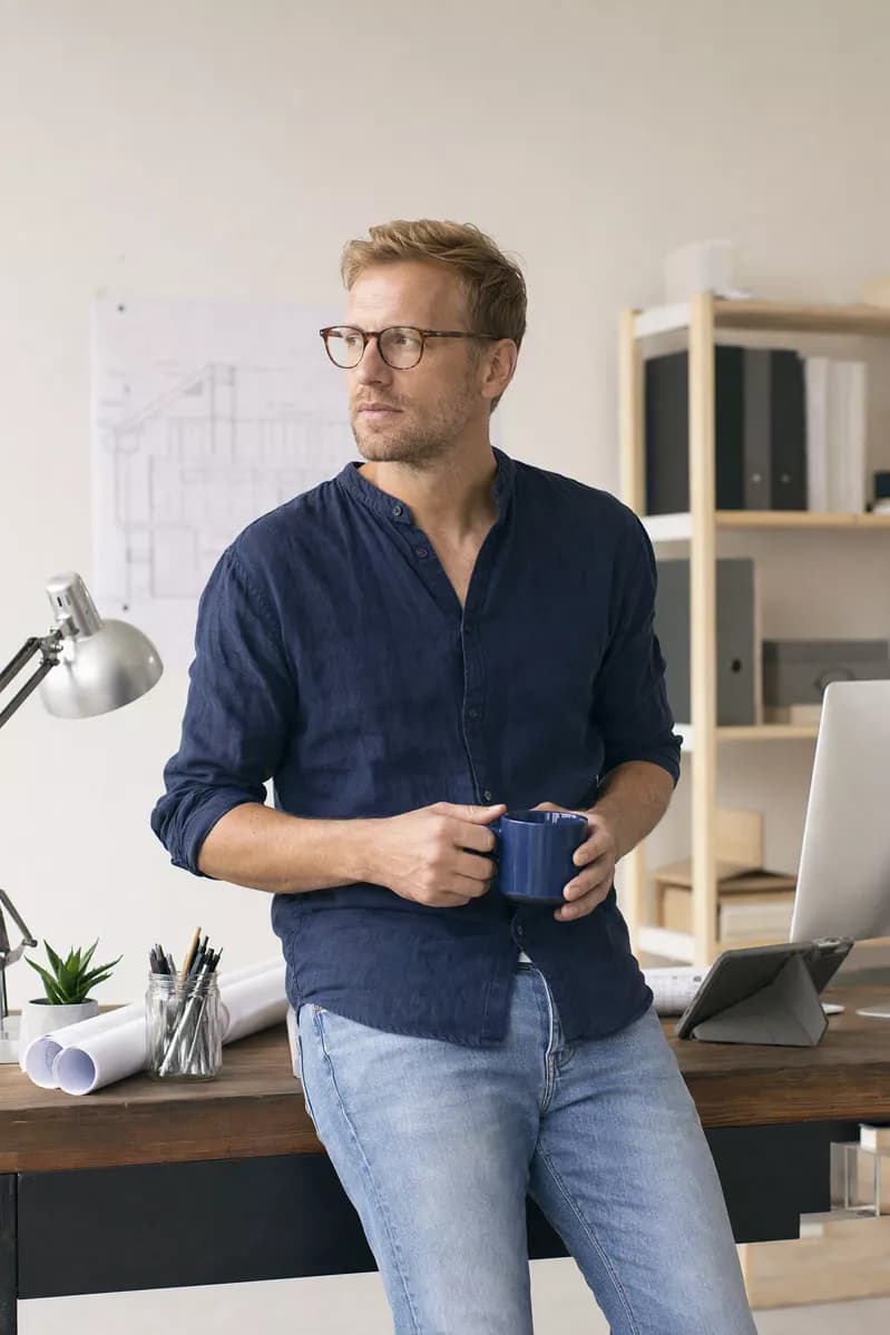 People and lifestyle: A blond man in his thirties with short hair, stubble and dark tortoiseshell glas