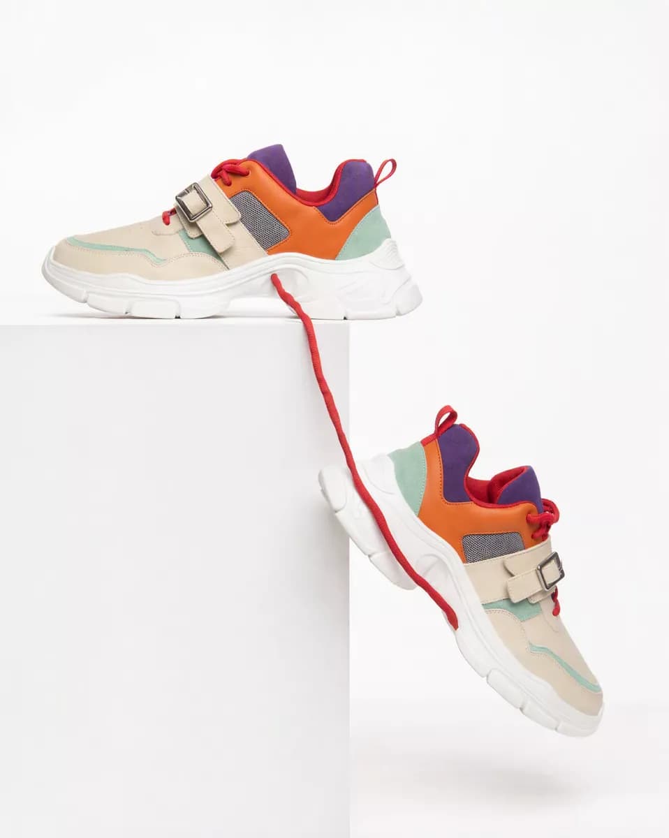 Product and e-commerce: Two chunky sneakers on a white seamless background with a white plinth. One rest