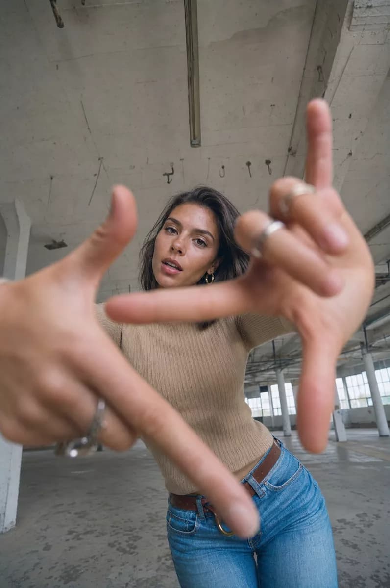 Social marketing: A wide-angle portrait taken from below in an empty industrial floor of a disused