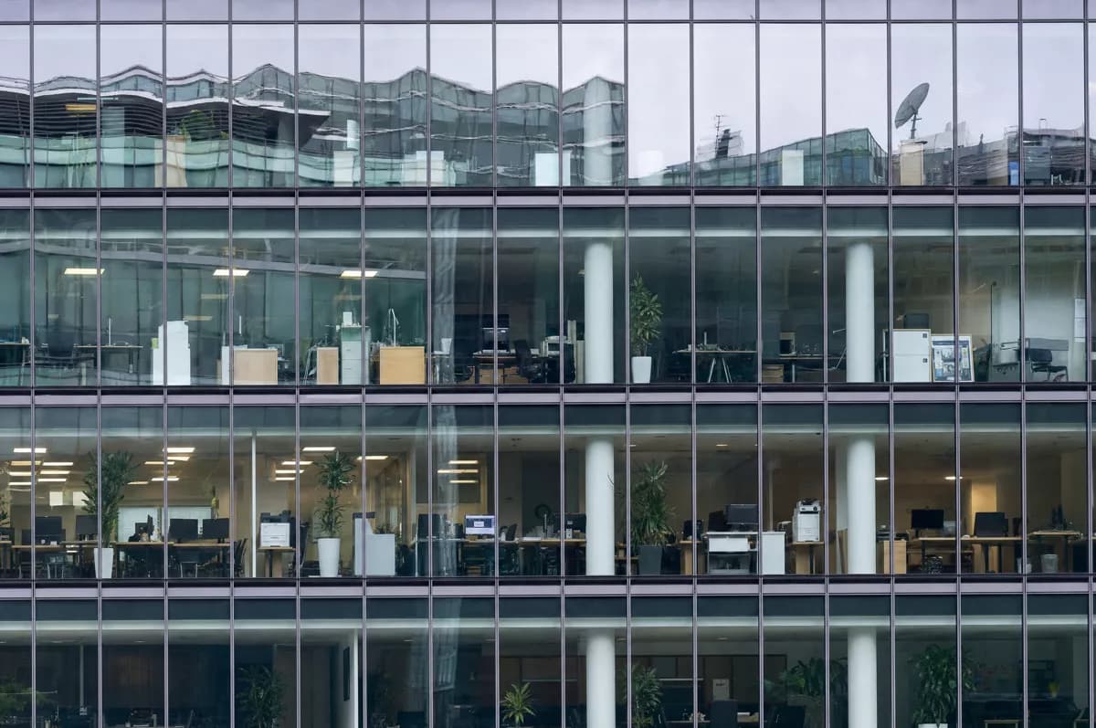 GPT Image 2 — Street and architecture: A flat frontal telephoto view of part of a glass office tower facade, filling th