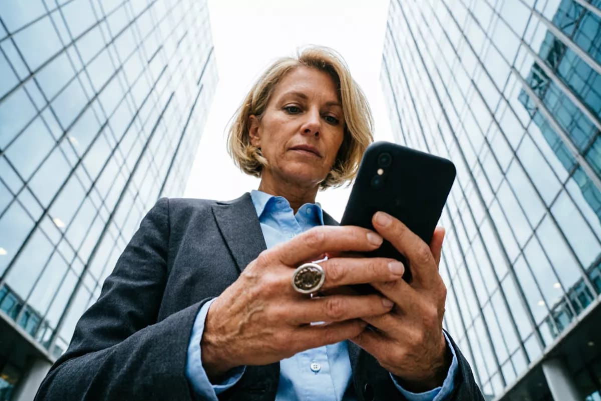 People and lifestyle: A woman in her forties with a short blonde bob, in a charcoal tailored blazer ov