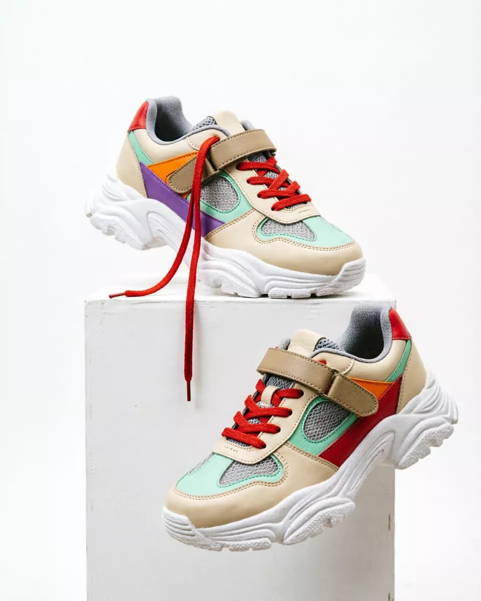 Product and e-commerce: Two chunky sneakers on a white seamless background with a white plinth. One rest
