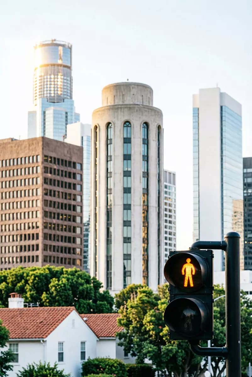 Street and architecture: A vertical telephoto city view with strongly compressed layers of buildings: in 