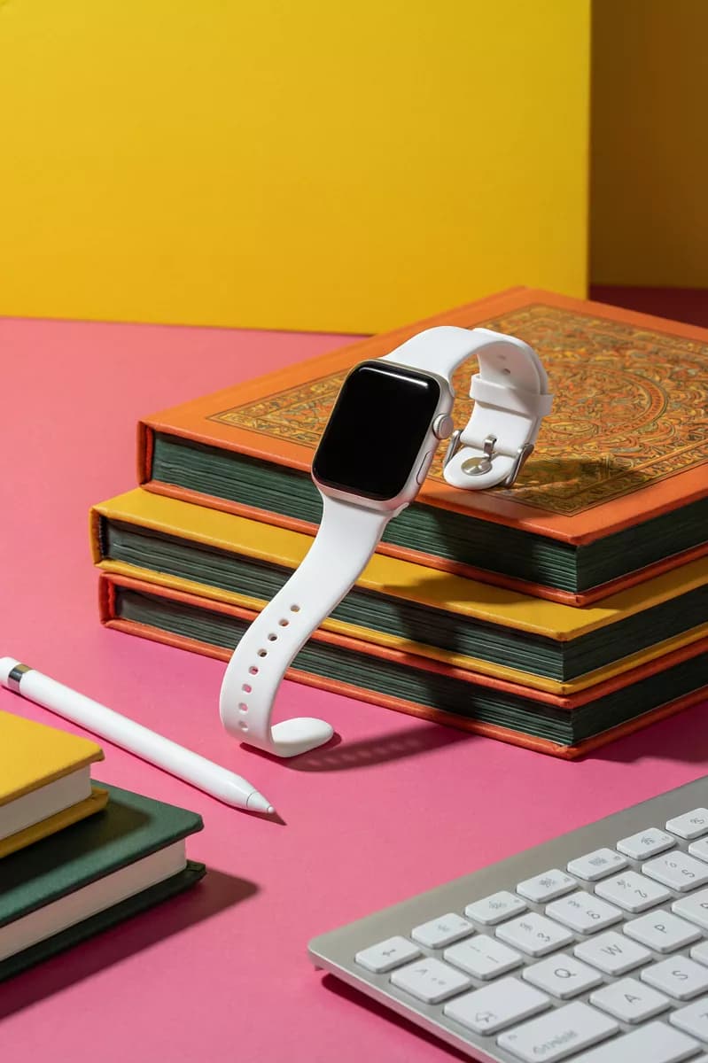 Product and e-commerce: A colour-blocked product still life: a white smartwatch with a square black scre