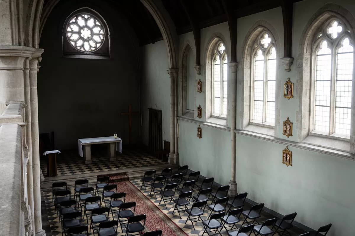 Qwen Image 2.0 Pro — Street and architecture: The interior of a neo-Gothic church seen from a high balcony looking down the na