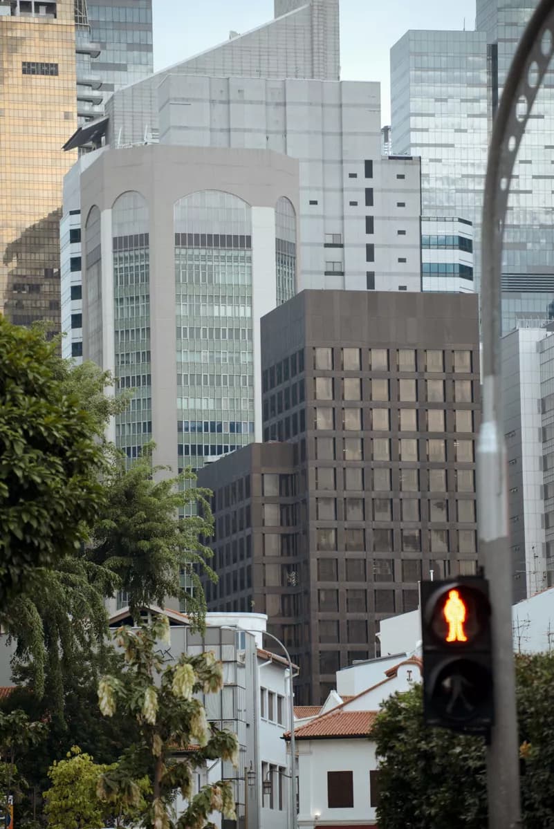 Real photograph — Street and architecture: A vertical telephoto city view with strongly compressed layers of buildings: in 