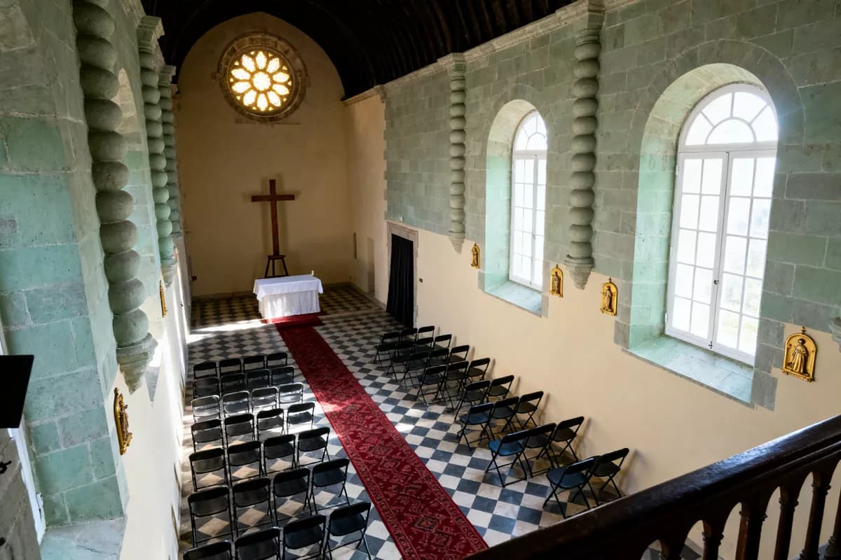 Street and architecture: The interior of a neo-Gothic church seen from a high balcony looking down the na
